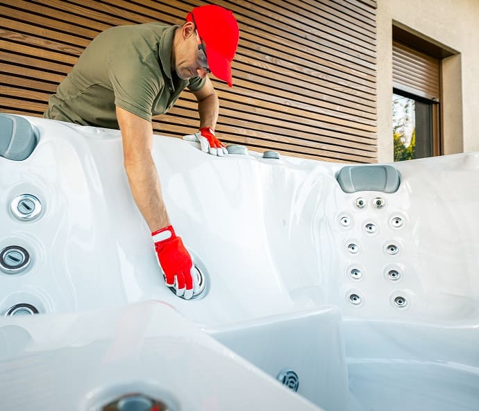 man-inspecting-hot-tub-in-suburban-home-setting-2026-01-09-00-02-50-utc (1) 1