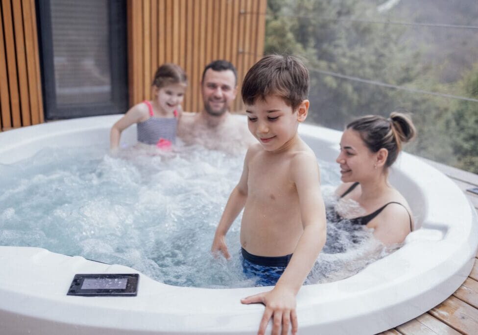 Family playing in clean Hot tub