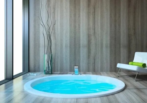 Clean indoor hot tub with clear blue water